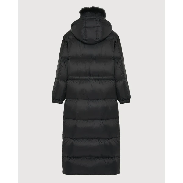Woman wearing Yves Salomon shearling fur coat – luxury outerwear at Coveti