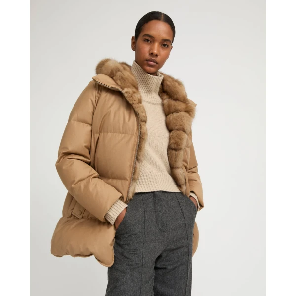 Woman wearing Yves Salomon shearling fur coat – luxury outerwear at Coveti