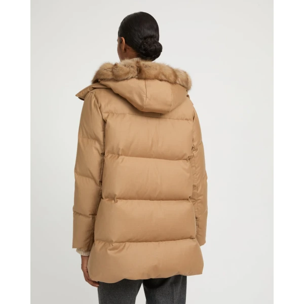 Woman wearing Yves Salomon shearling fur coat – luxury outerwear at Coveti