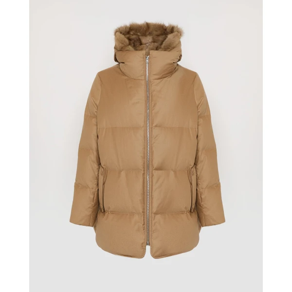 Woman wearing Yves Salomon shearling fur coat – luxury outerwear at Coveti