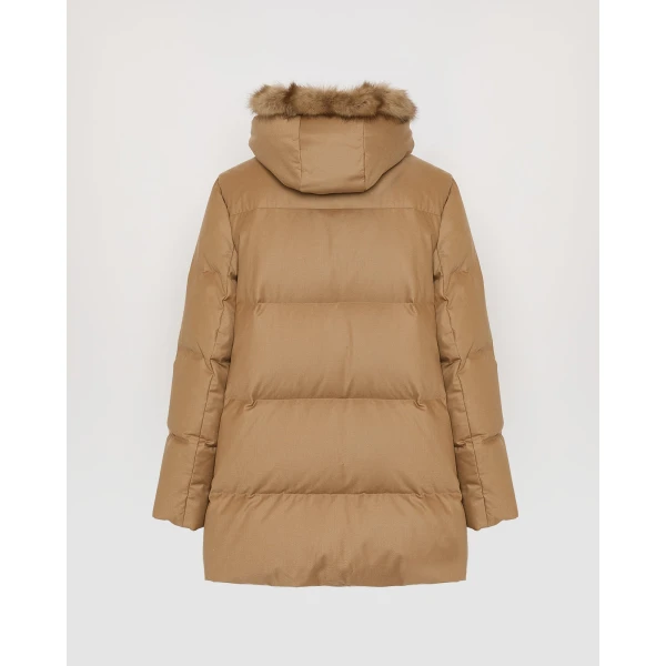 Woman wearing Yves Salomon shearling fur coat – luxury outerwear at Coveti
