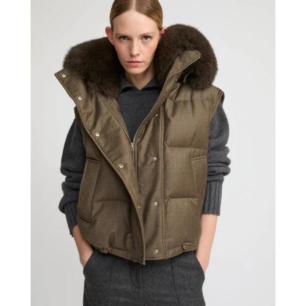 Woman wearing Yves Salomon shearling fur coat – luxury outerwear at Coveti