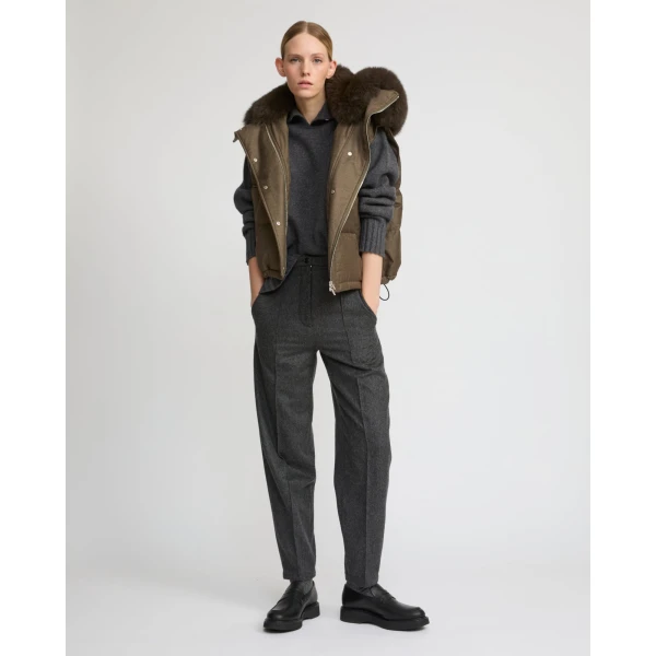 Woman wearing Yves Salomon shearling fur coat – luxury outerwear at Coveti