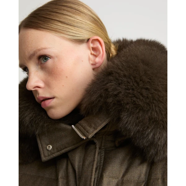 Woman wearing Yves Salomon shearling fur coat – luxury outerwear at Coveti