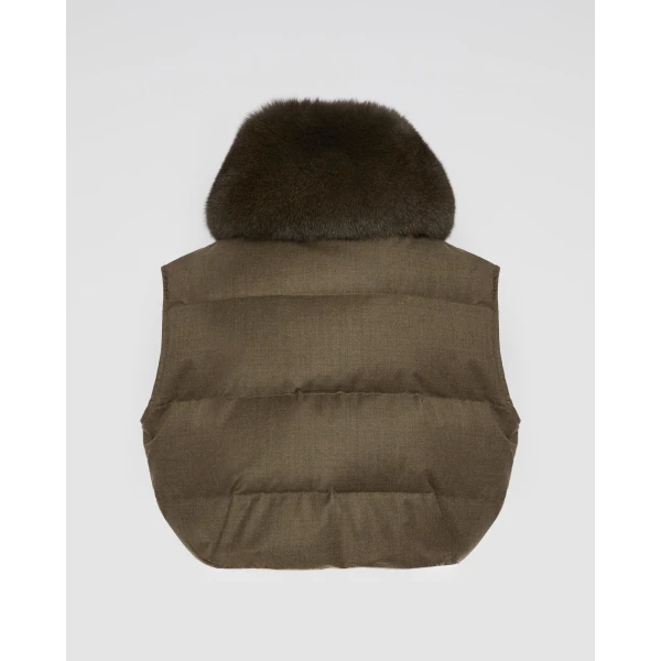 Woman wearing Yves Salomon shearling fur coat – luxury outerwear at Coveti