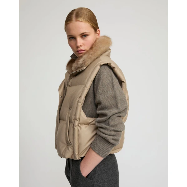 Woman wearing Yves Salomon shearling fur coat – luxury outerwear at Coveti