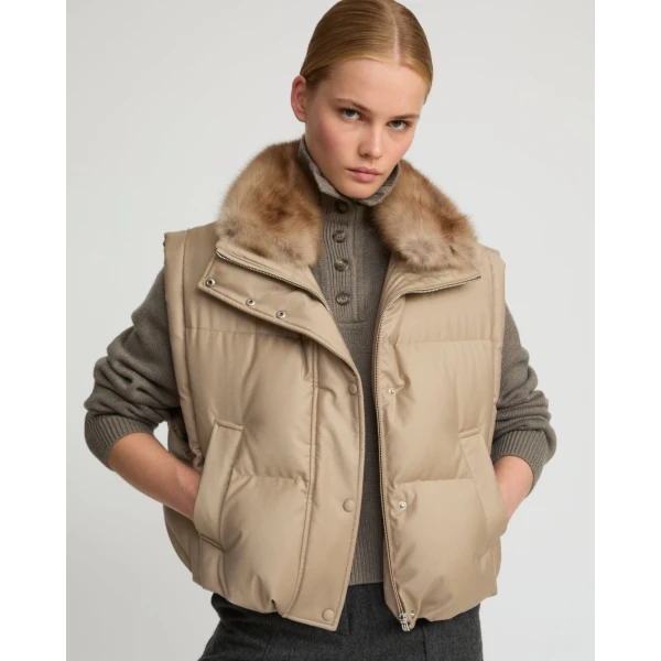 Woman wearing Yves Salomon shearling fur coat – luxury outerwear at Coveti