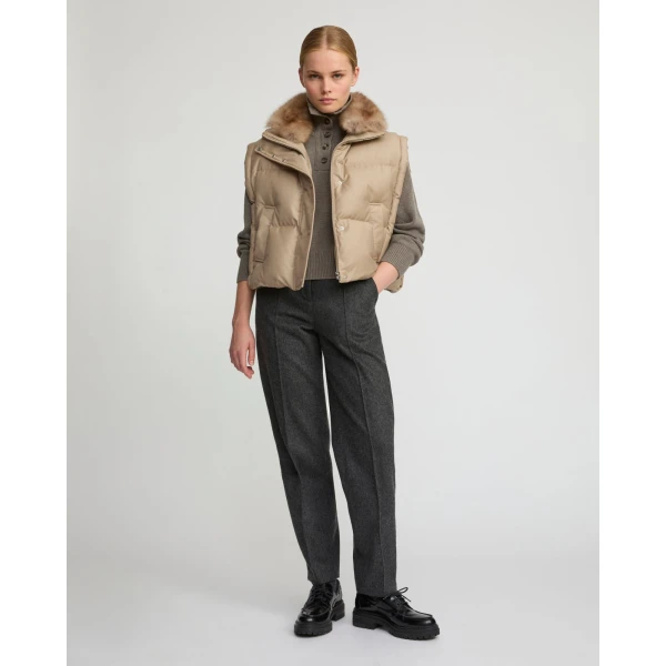 Woman wearing Yves Salomon shearling fur coat – luxury outerwear at Coveti