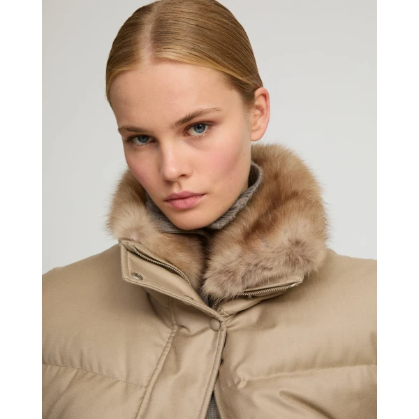 Woman wearing Yves Salomon shearling fur coat – luxury outerwear at Coveti