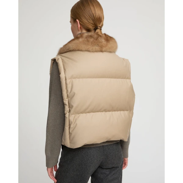 Woman wearing Yves Salomon shearling fur coat – luxury outerwear at Coveti