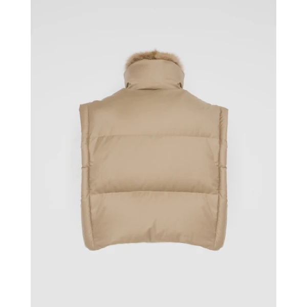 Woman wearing Yves Salomon shearling fur coat – luxury outerwear at Coveti