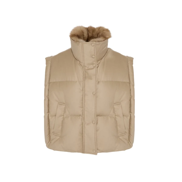 Woman wearing Yves Salomon shearling fur coat – luxury outerwear at Coveti