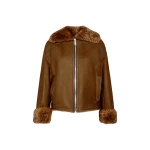 Woman wearing Yves Salomon shearling fur coat – luxury outerwear at Coveti
