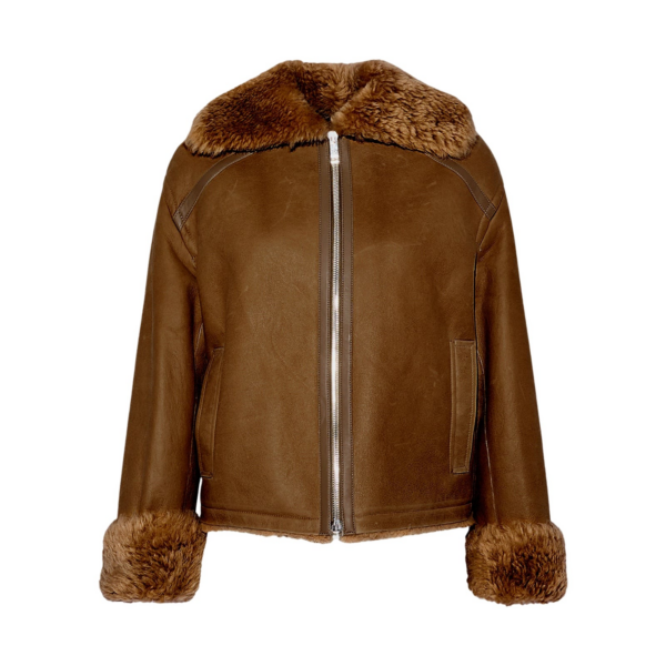 Woman wearing Yves Salomon shearling fur coat – luxury outerwear at Coveti