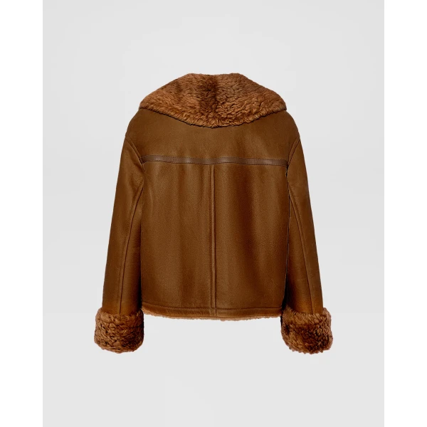 Woman wearing Yves Salomon shearling fur coat – luxury outerwear at Coveti