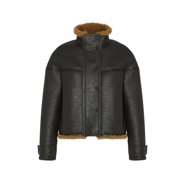 Woman wearing Yves Salomon shearling fur coat – luxury outerwear at Coveti