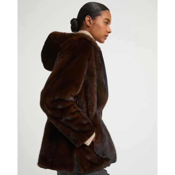 Woman wearing Yves Salomon shearling fur coat – luxury outerwear at Coveti