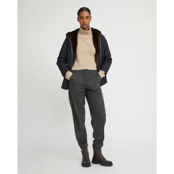 Woman wearing Yves Salomon shearling fur coat – luxury outerwear at Coveti