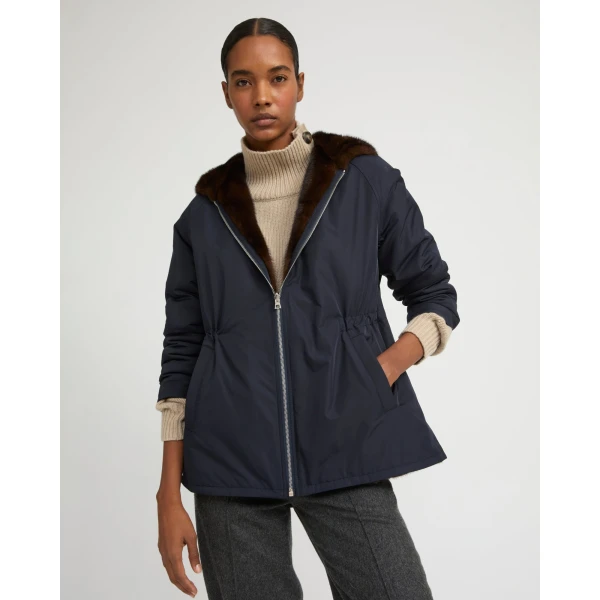 Woman wearing Yves Salomon shearling fur coat – luxury outerwear at Coveti