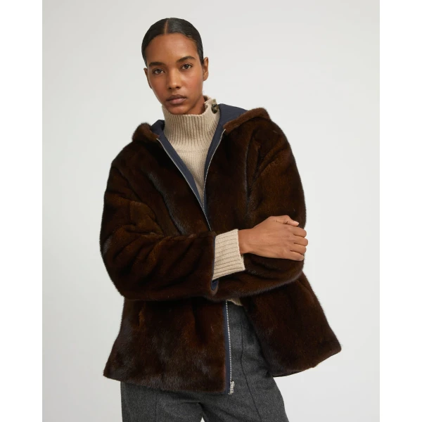 Woman wearing Yves Salomon shearling fur coat – luxury outerwear at Coveti