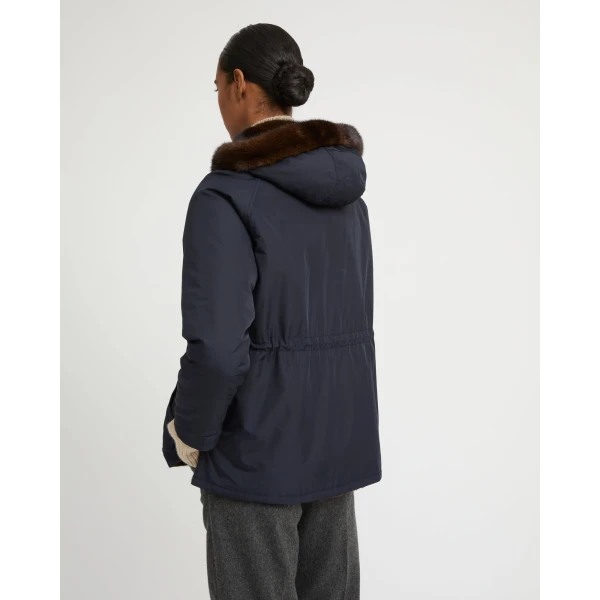 Woman wearing Yves Salomon shearling fur coat – luxury outerwear at Coveti