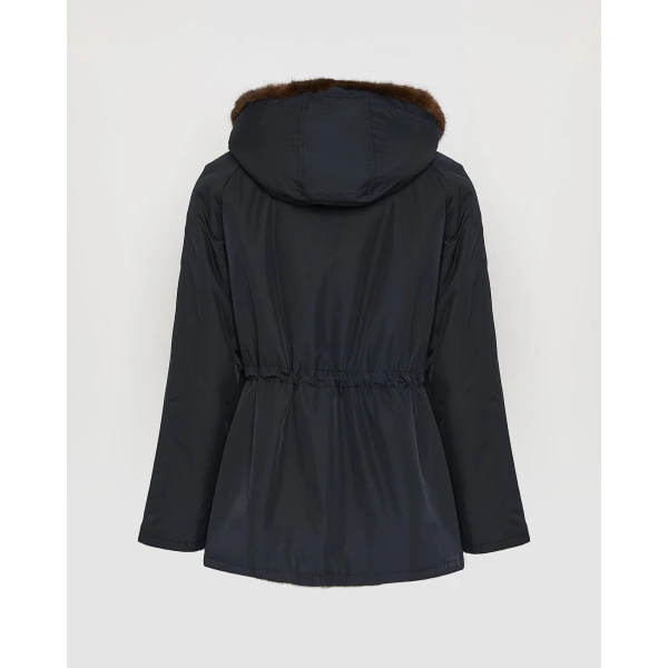 Woman wearing Yves Salomon shearling fur coat – luxury outerwear at Coveti