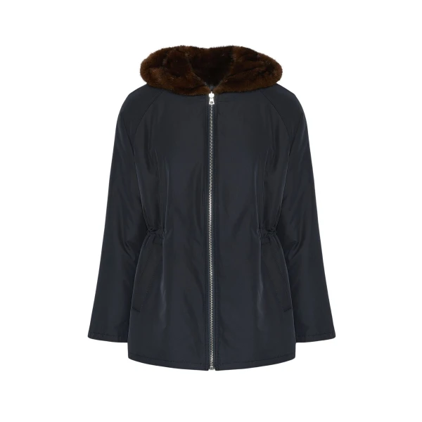 Woman wearing Yves Salomon shearling fur coat – luxury outerwear at Coveti