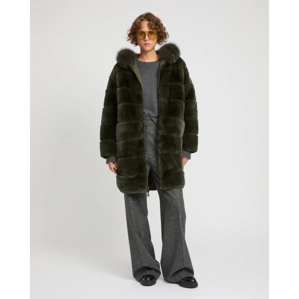 Woman wearing Yves Salomon shearling fur coat – luxury outerwear at Coveti