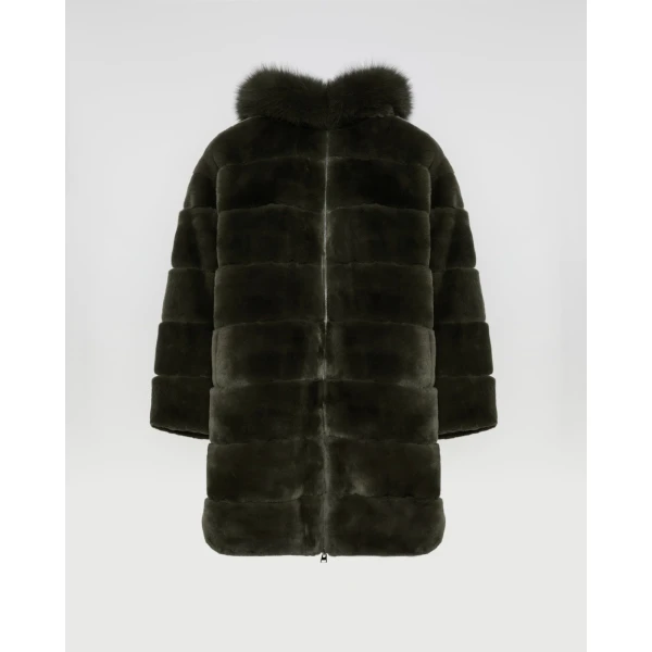 Woman wearing Yves Salomon shearling fur coat – luxury outerwear at Coveti
