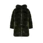 Woman wearing Yves Salomon shearling fur coat – luxury outerwear at Coveti