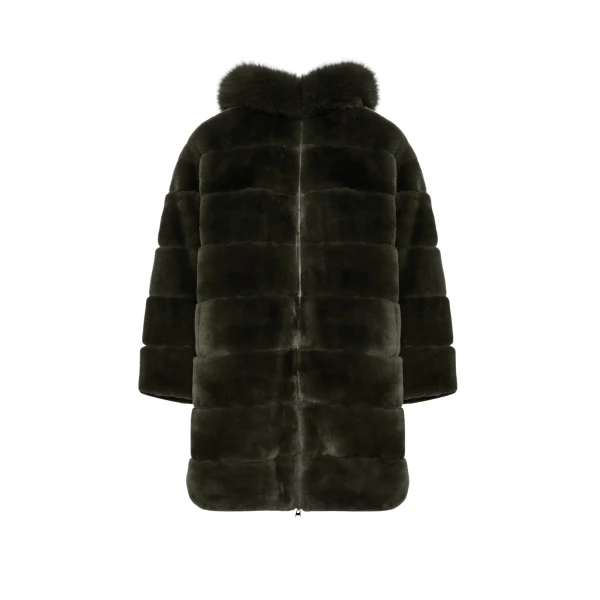 Woman wearing Yves Salomon shearling fur coat – luxury outerwear at Coveti