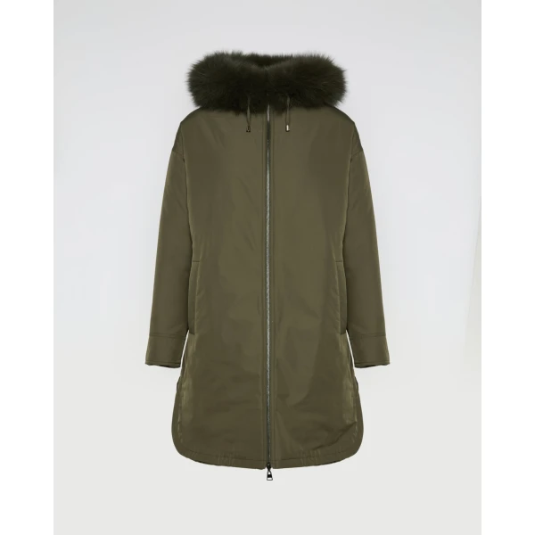 Woman wearing Yves Salomon shearling fur coat – luxury outerwear at Coveti