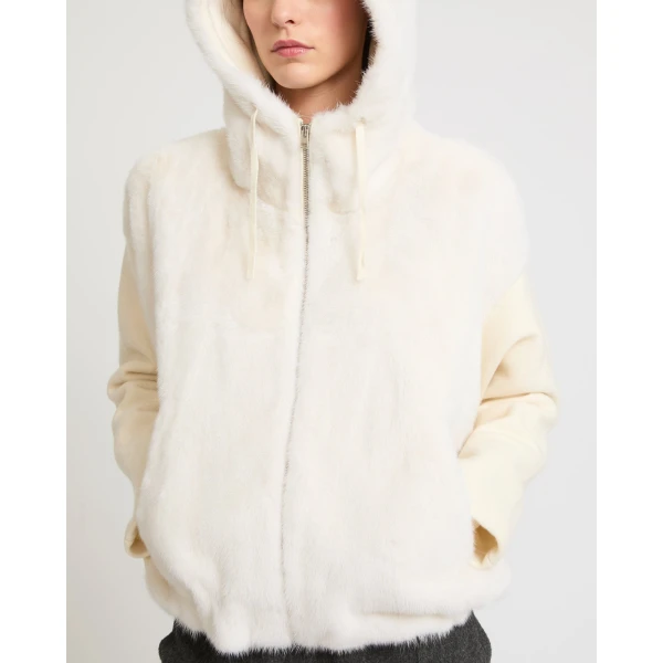 Woman wearing Yves Salomon shearling fur coat – luxury outerwear at Coveti