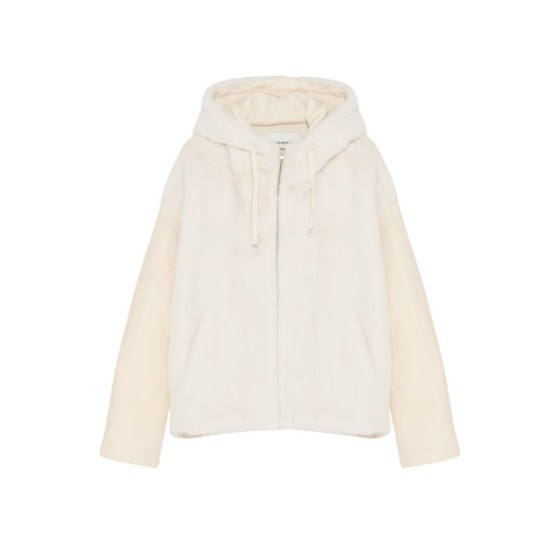 Woman wearing Yves Salomon shearling fur coat – luxury outerwear at Coveti
