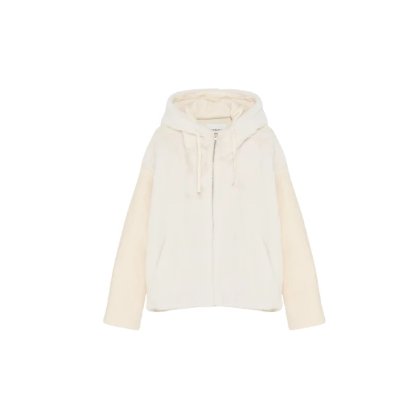 Woman wearing Yves Salomon shearling fur coat – luxury outerwear at Coveti