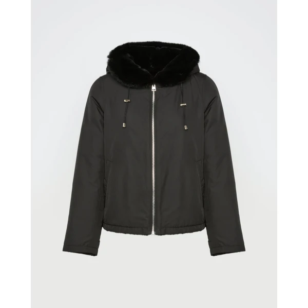 Woman wearing Yves Salomon shearling fur coat – luxury outerwear at Coveti