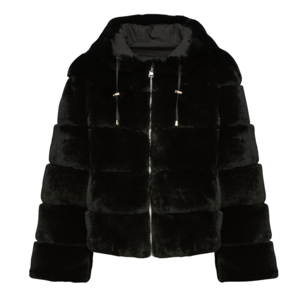 Woman wearing Yves Salomon shearling fur coat – luxury outerwear at Coveti