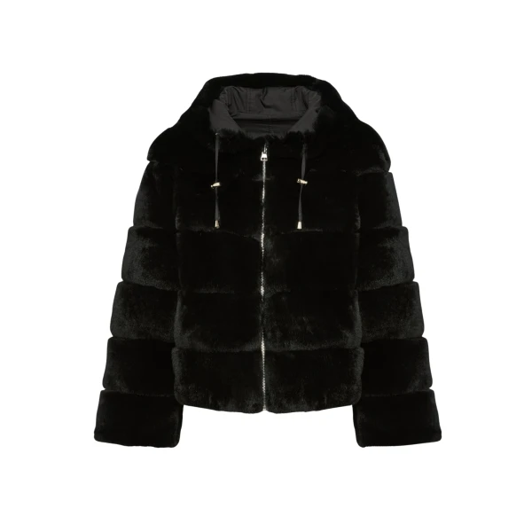 Woman wearing Yves Salomon shearling fur coat – luxury outerwear at Coveti