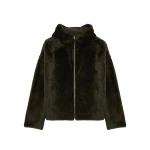 Woman wearing Yves Salomon shearling fur coat – luxury outerwear at Coveti
