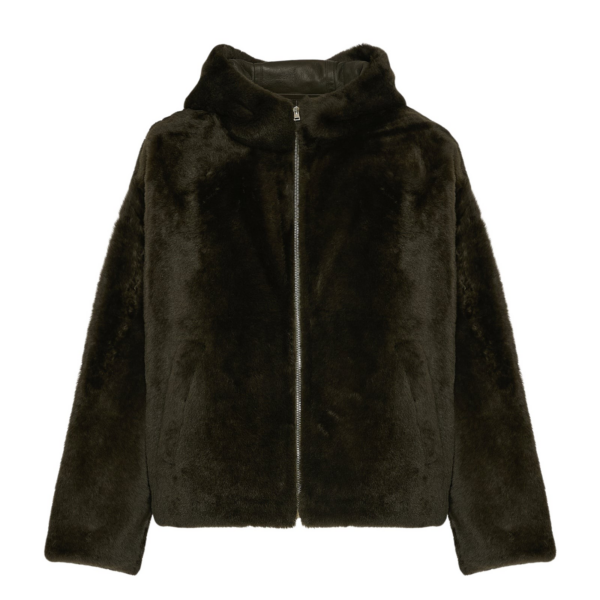 Woman wearing Yves Salomon shearling fur coat – luxury outerwear at Coveti