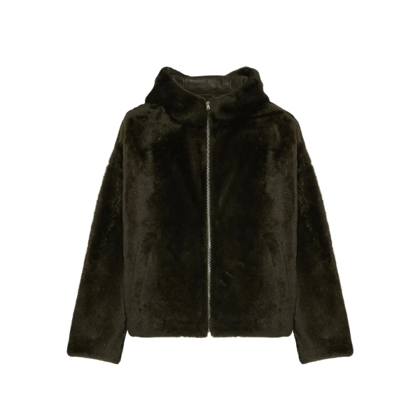 Woman wearing Yves Salomon shearling fur coat – luxury outerwear at Coveti