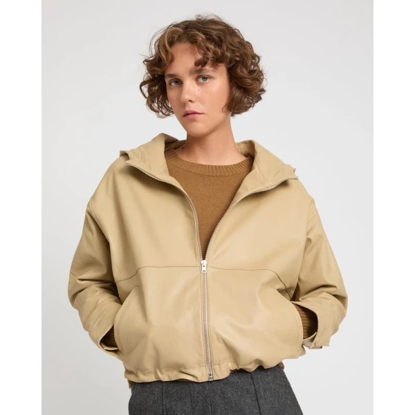 Woman wearing Yves Salomon shearling fur coat – luxury outerwear at Coveti