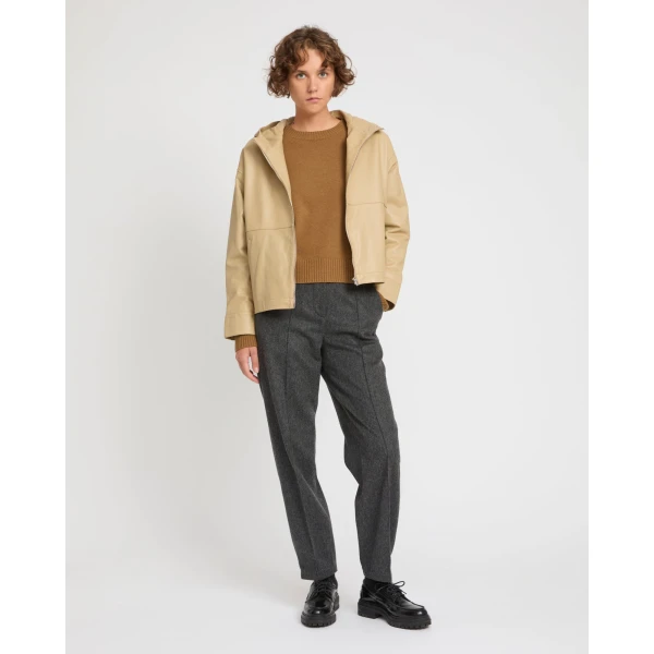 Woman wearing Yves Salomon shearling fur coat – luxury outerwear at Coveti