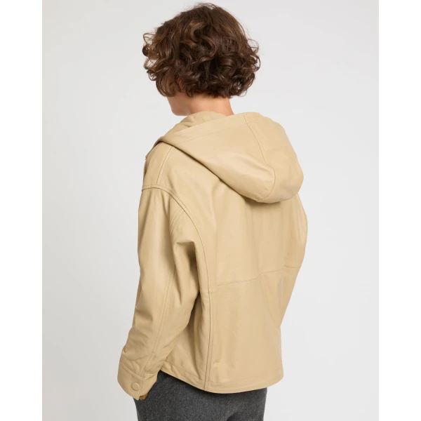 Woman wearing Yves Salomon shearling fur coat – luxury outerwear at Coveti