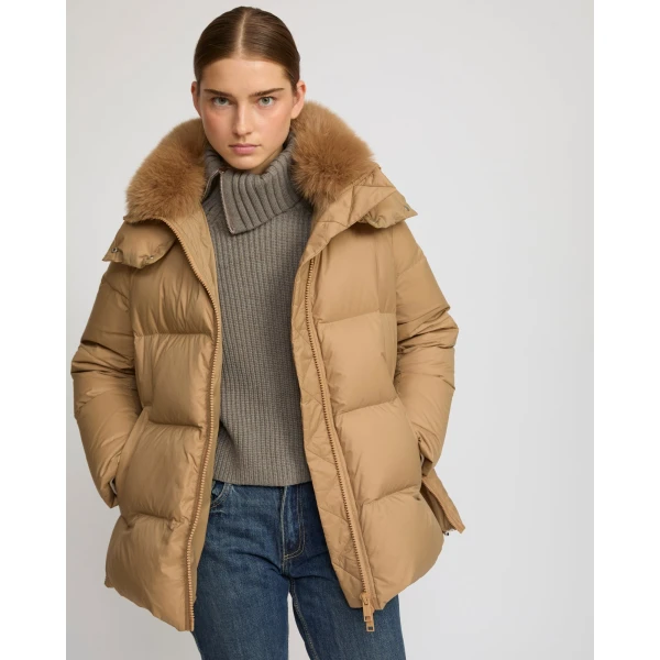 Woman wearing Yves Salomon shearling fur coat – luxury outerwear at Coveti