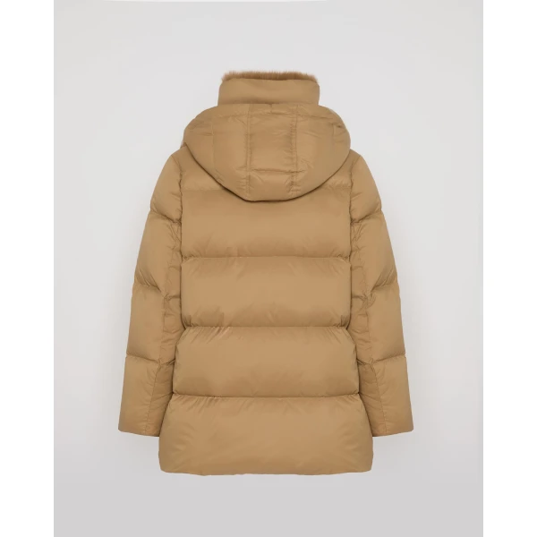 Woman wearing Yves Salomon shearling fur coat – luxury outerwear at Coveti