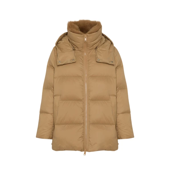 Woman wearing Yves Salomon shearling fur coat – luxury outerwear at Coveti