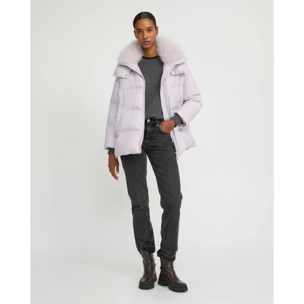 Woman wearing Yves Salomon shearling fur coat – luxury outerwear at Coveti