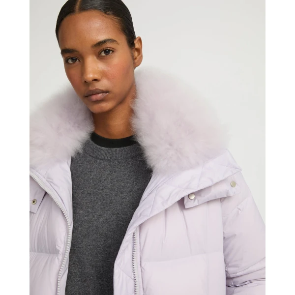 Woman wearing Yves Salomon shearling fur coat – luxury outerwear at Coveti