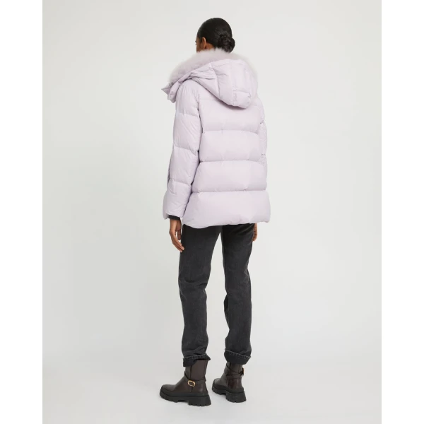 Woman wearing Yves Salomon shearling fur coat – luxury outerwear at Coveti